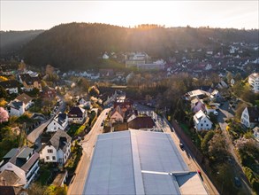 A sunny spring morning over a village with a view of roofs and trees, Calw, Black Forest, Germany,