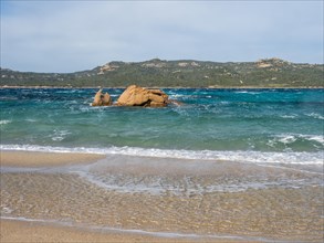 Rock formation in the sea, Spiaggia Capriccioli, Costa Smeralda, Sardinia, Italy, Europe