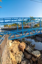 A beautiful blue bridge in the port of the touristic coastal town Mogan in the south of Gran