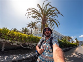 Selfie of tourist man in summer in the dunes of Maspalomas, Gran Canaria, Canary Islands