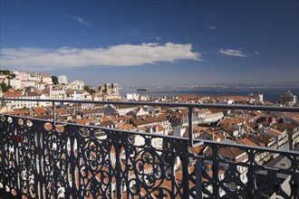 Grey wrought iron railing and high angle view of buildings with traditional terracotta tiled