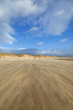 Sand blowing over beach, clouds, LLanddwyn Bay, Newborough, Isle of Anglesey, Wales, Great Britain