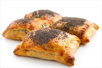 Fresh puff pastries topped with poppy seeds on a slate surface, AI generated