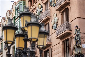 Clay parasols on the facade of a house on the Ramblas in Barcelona, Spain, Europe