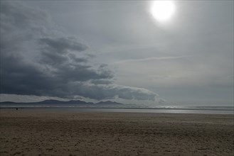 Beach, clouds, mountains, sun, LLanddwyn Bay, Newborough, Isle of Anglesey, Wales, Great Britain