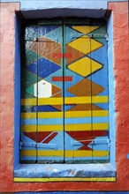 Colourful houses, Burano, Burano Island, Abstract artwork on a window with bright colours and