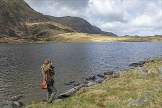 Woman photographed, Lake LLyn Idwal, Snowdonia National Park near Pont Pen-y-benglog, Bethesda,
