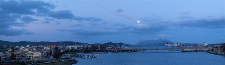 Full moon over the harbour of Olbia, blue hour, panoramic shot, Olbia, Sardinia, Italy, Europe