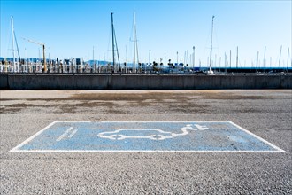 Parking space for an electric car on the beach in Barcelona, Spain, Europe