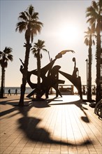 Sculpture with athletes on the beach in Barcelona, Spain, Europe