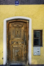 Old wooden door with carvings, Kempten, Allgaeu, Swabia, Bavaria, Germany, Europe