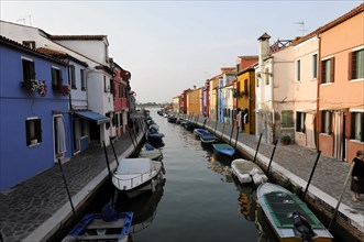Colourful houses, Burano, Burano island, canal surrounded by colourful houses with boats and a