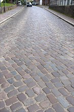 Village street paved with basalt stones, Mecklenburg-Vorpommern, Germany, Europe