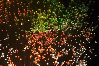 Close-up of red, green and white lighted fibre optic cables, Studio Composition, Quebec, Canada,
