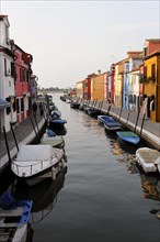 Colourful houses, Burano, Burano Island, A quiet canal flows between a row of colourful houses and