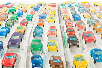 Cars standing in a traffic jam, drawing with coloured pencils by a child of preschool age, primary