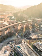 Drone view of a city bridge with shadows and soft evening light, sunrise, Nagold, Black Forest,