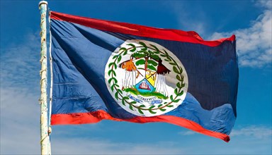Flags, the national flag of Belize flutters in the wind