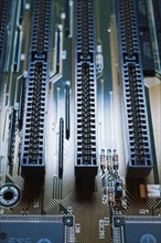 Close-up of blue lighted electronic computer circuit board with lines, Studio Composition, Quebec,