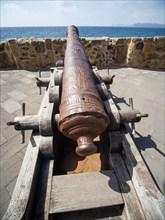 Old cannon, fortress wall of Alghero, Sardinia, Italy, Europe