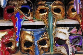 Island of Murano, Venice, Extravagantly decorated Venetian carnival masks in vivid colours, Venice,