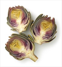 Halved artichokes showing purple and green hues on a white background, AI generated
