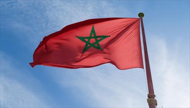 Flag, the national flag of Morocco flutters in the wind