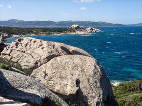 Typical granite rock formations in front of a bay, Baja Sardinia, Costa Smeralda, Sardinia, Italy,