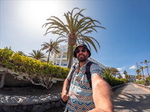 Selfie of tourist man in summer in the dunes of Maspalomas, Gran Canaria, Canary Islands