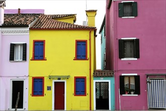 Colourful houses, Burano, Burano Island, Two brightly coloured houses next to each other, one