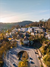 Bright sunset over a town embedded in a picturesque mountain landscape, Calw, Black Forest,