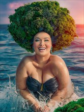 Ecstatic empowered plus size woman in black swimwear with a moss headdress in ocean splashes, earth