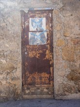 Weathered gate, San Pantaleo, Sardinia, Italy, Europe