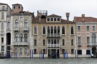 Historic building with colourful facade on a water canal in Venice, Venice, Veneto, Italy, Europe