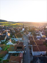 The low sun casts shadows over a quiet city street, Calw, Black Forest, Germany, Europe