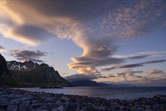 Cloudscape, view from Hamnoy over the sea along Moskenesoya, Flakstadoya and Vestvagoya. Several