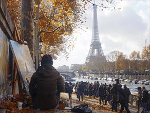 Kuenstler malt den Eiffelturm auf einer mit Herbstlaub bedeckten Promenade, Lifestyle in Paris,