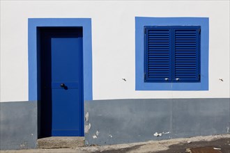 White house facade with blue window and entrance door, Betancuria, Fuerteventur, Canary Island,