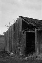 Dilapidated wooden shed in black and white, Neubeuern, Germany, Europe