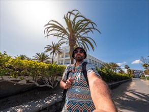Selfie of tourist walking towards the dunes of Maspalomas, Gran Canaria, Canary Islands