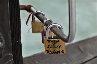 Love locks, Ponte dell Akademica, Grand Canal, Several love locks with names and dates on a bridge