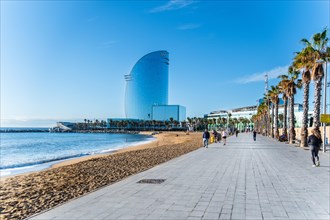 Jogger on the promenade on the beach in Bercelona, Spain, Europe