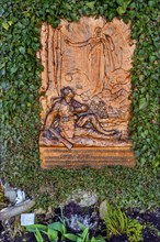 Gravestone entwined with ivy depicting a soldier with an Iron Cross, Allgaeu, Swabia, Bavaria,