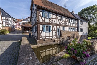 Former mill on the Muehlgraben, historic half-timbered house from around 1709, cultural monument,