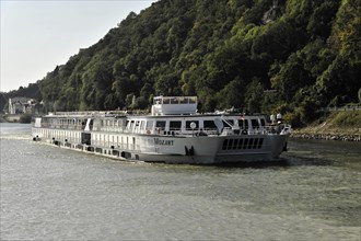 The cruise ship 'Mozart' sails on a sunny river, Passau, Bavaria, Germany, Europe