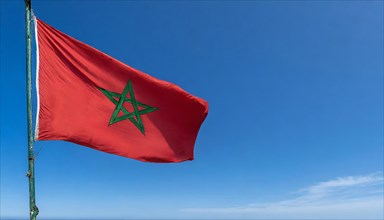 Flag, the national flag of Morocco flutters in the wind