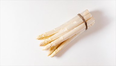 Bundled white asparagus tied together with a brown ribbon, AI generated, AI generated