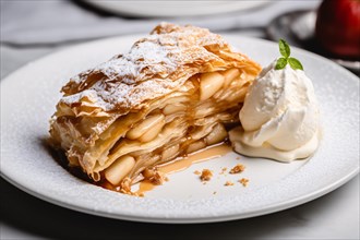 Apple strudel with whipped cream on plate. KI generiert, generiert, AI generated