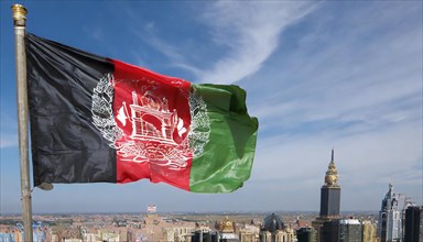 Flag, the national flag of Afghanistan flutters in the wind