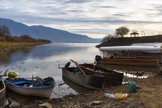 Shore with fishing boats, excursion boats, morning atmosphere at Lake Kerkini, Lake Kerkini,